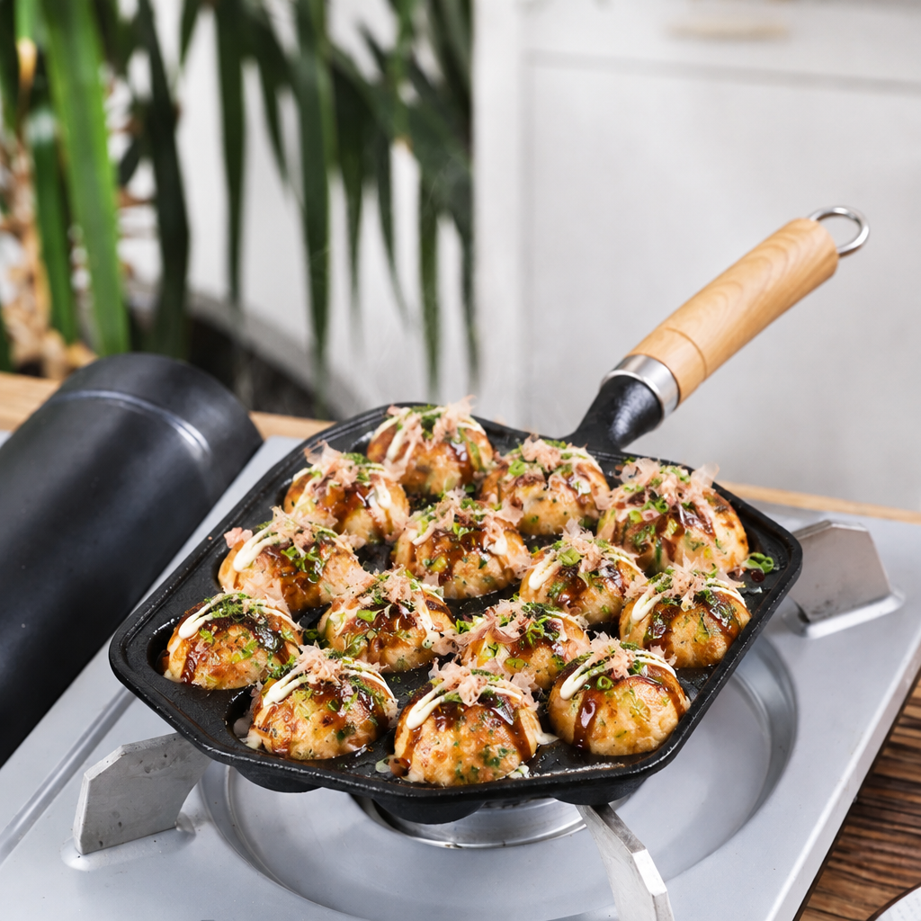 Person using a spatula to cook food in a non-stick pan on a stove.