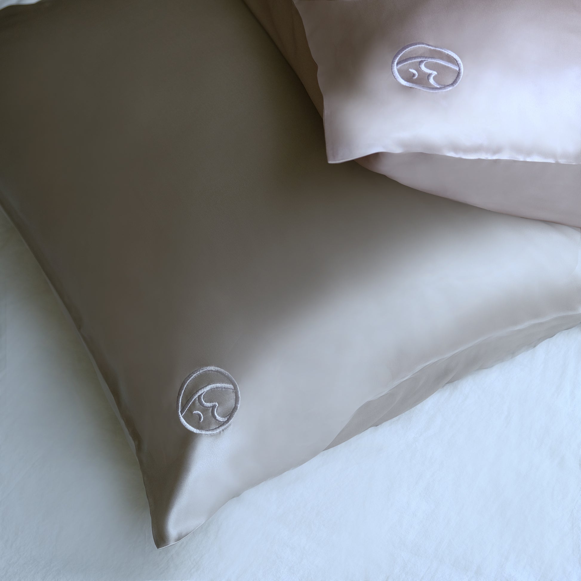 Close-up of premium 6A silk texture on a lilac pillowcase, ultra-smooth, breathable and eco-friendly.