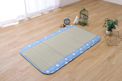 Japanese tatami baby mat made from natural igusa grass, featuring a blue denim border, designed to be vegan, sustainable, and safe for infants.