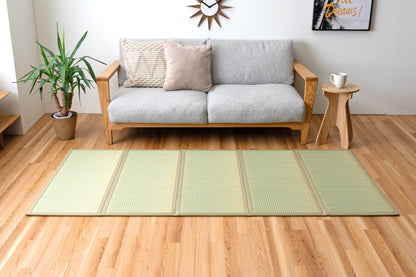Tatami foldable mattress in Five placed in a minimalist living space, crafted from natural igusa grass, vegan and sustainable.