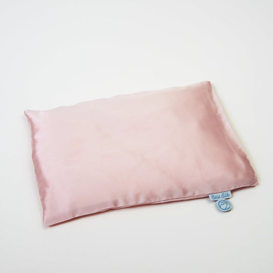 Baby pink silk pillow made from premium 6A silk, vegan and sustainable, breathable and ultra-soft for restful infant sleep.