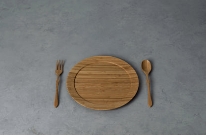 Sustainable  bamboo wooden plate on a rustic table.