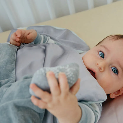 Premium 6A silk baby blanket in baby blue styled on a cozy nursery bed, smooth, breathable, vegan and sustainable.