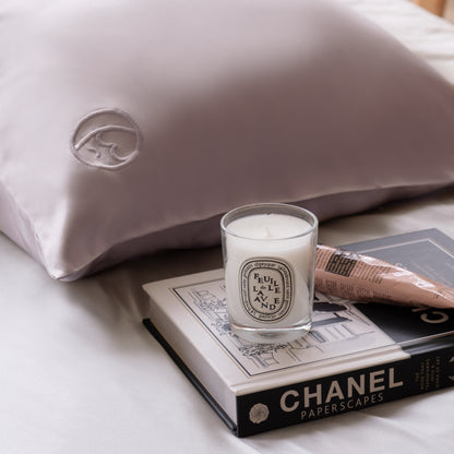 Premium 6A silk pillowcase in lilac styled on a luxury bed, smooth, breathable, vegan and sustainable.