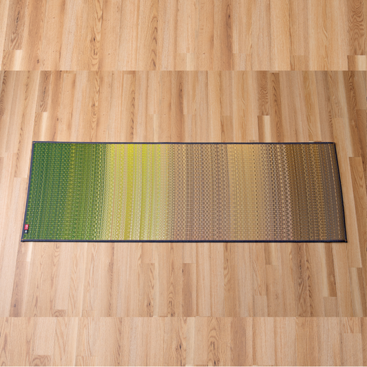 Japanese tatami yoga mat in Joy Green made from natural igusa rush grass, vegan and sustainable, breathable for yoga and stretching.